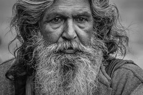 bearded man with long hair representing a grooming routine