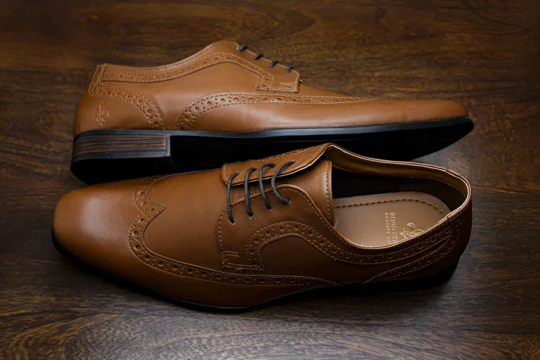 brown leather lace up shoes illustrating the 10 wardrobe essentials every man needs