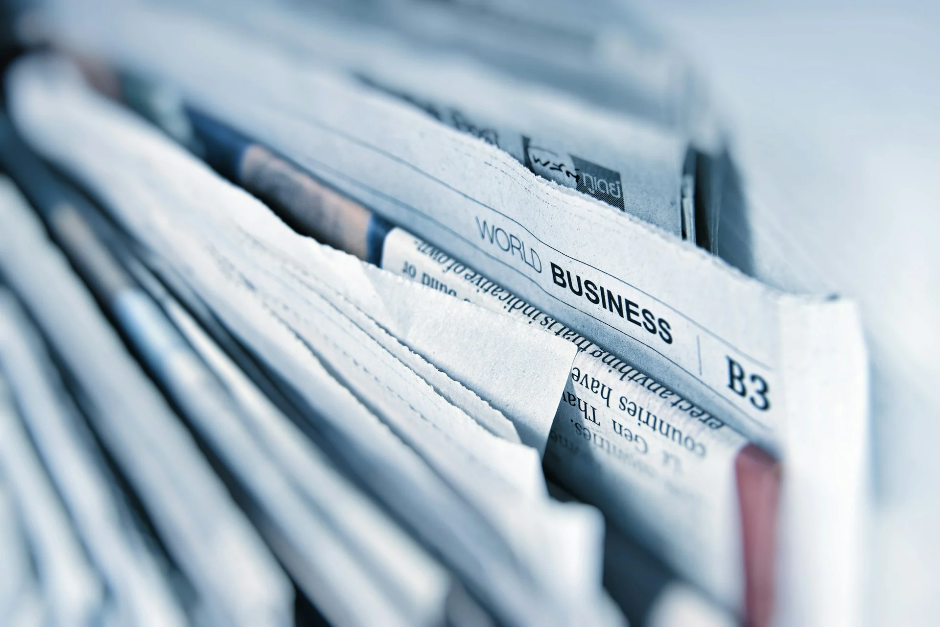 investor reading index performance tables in a newspaper