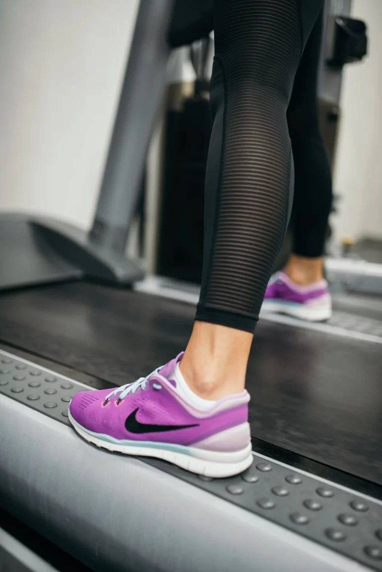 close-up of an athlete running on a treadmill representing steady energy levels