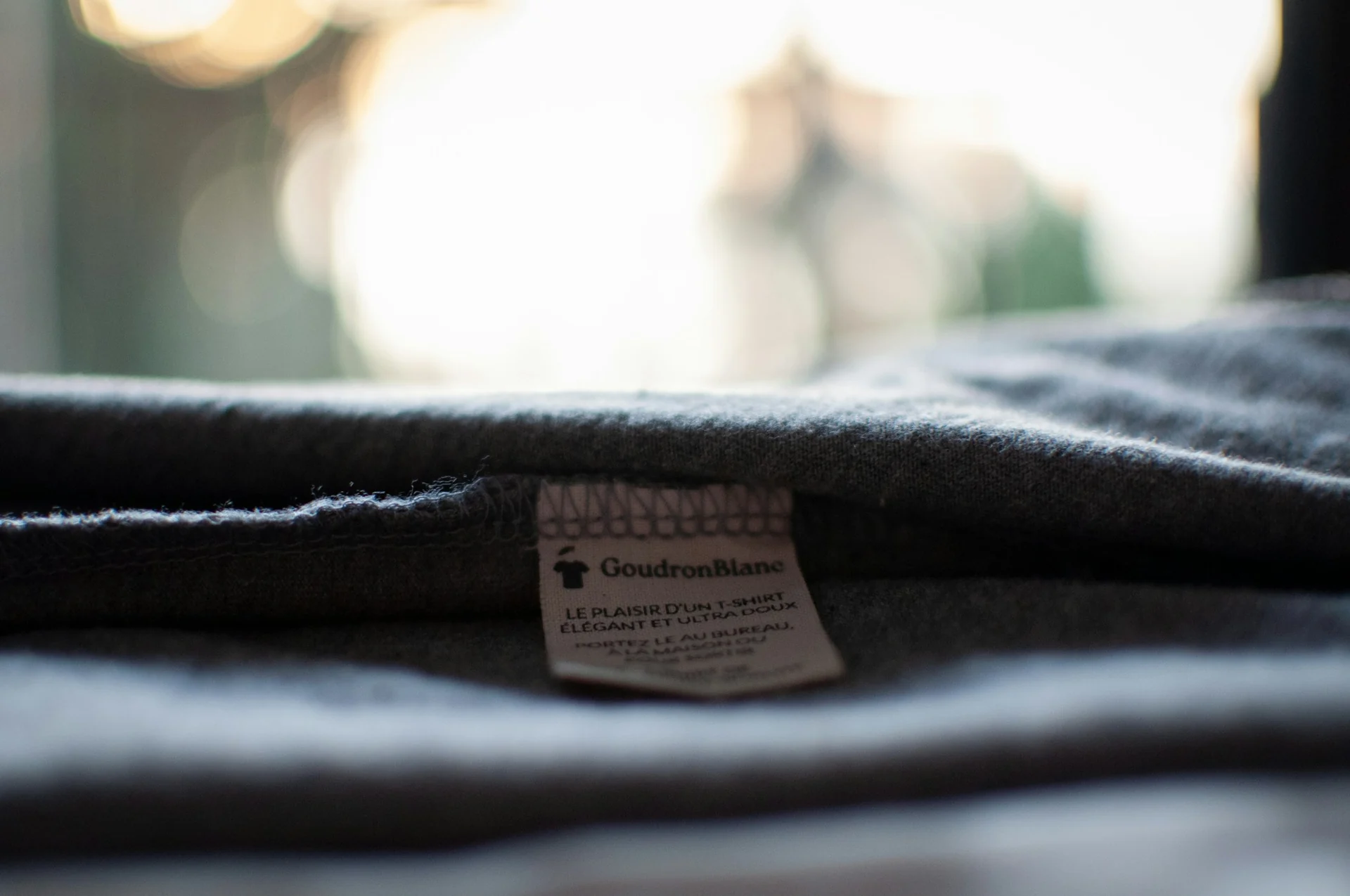 clothing size label showing the height range a medium is cut for