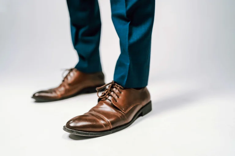 person blue pants black leather shoes illustrating what shoes to wear with what