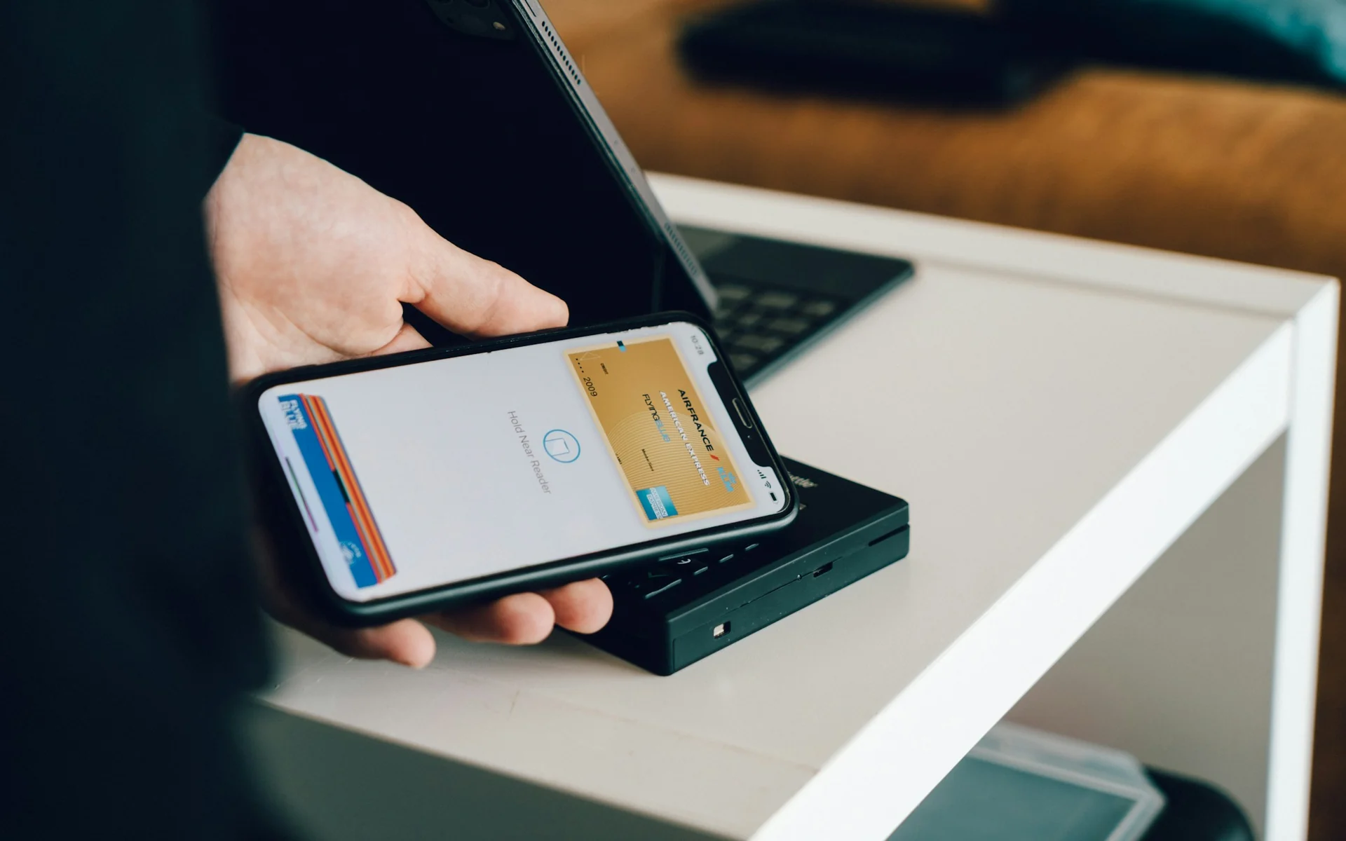 man initiating a bank transfer between two accounts on his phone