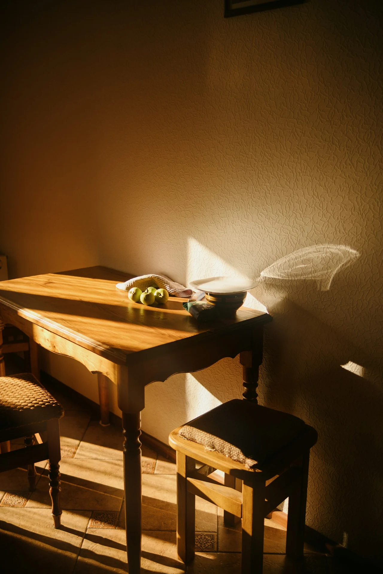 pumpkin seeds, almonds, spinach and black beans arranged on a wooden kitchen table
