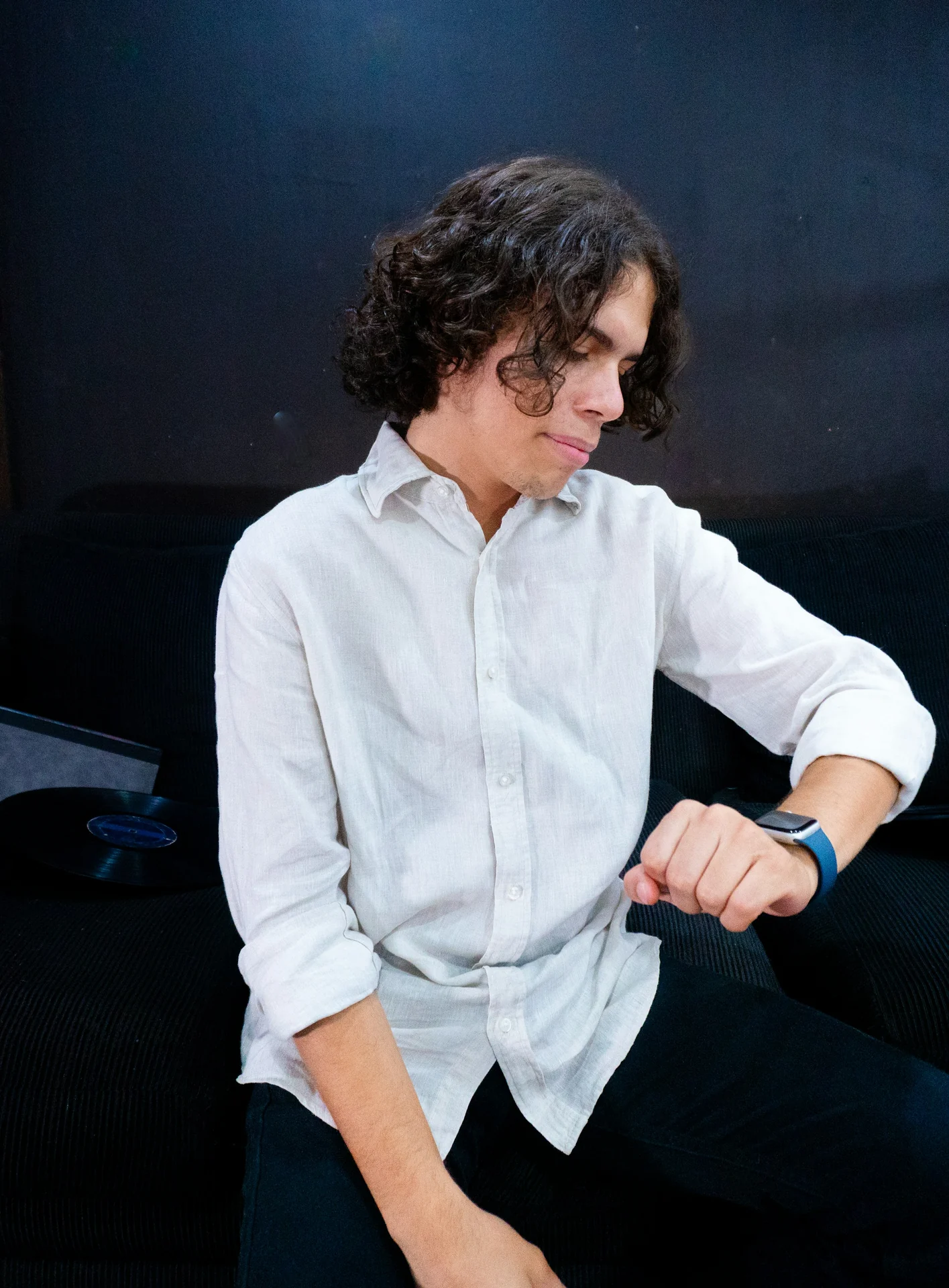 man measuring the flat width of his wrist with a ruler